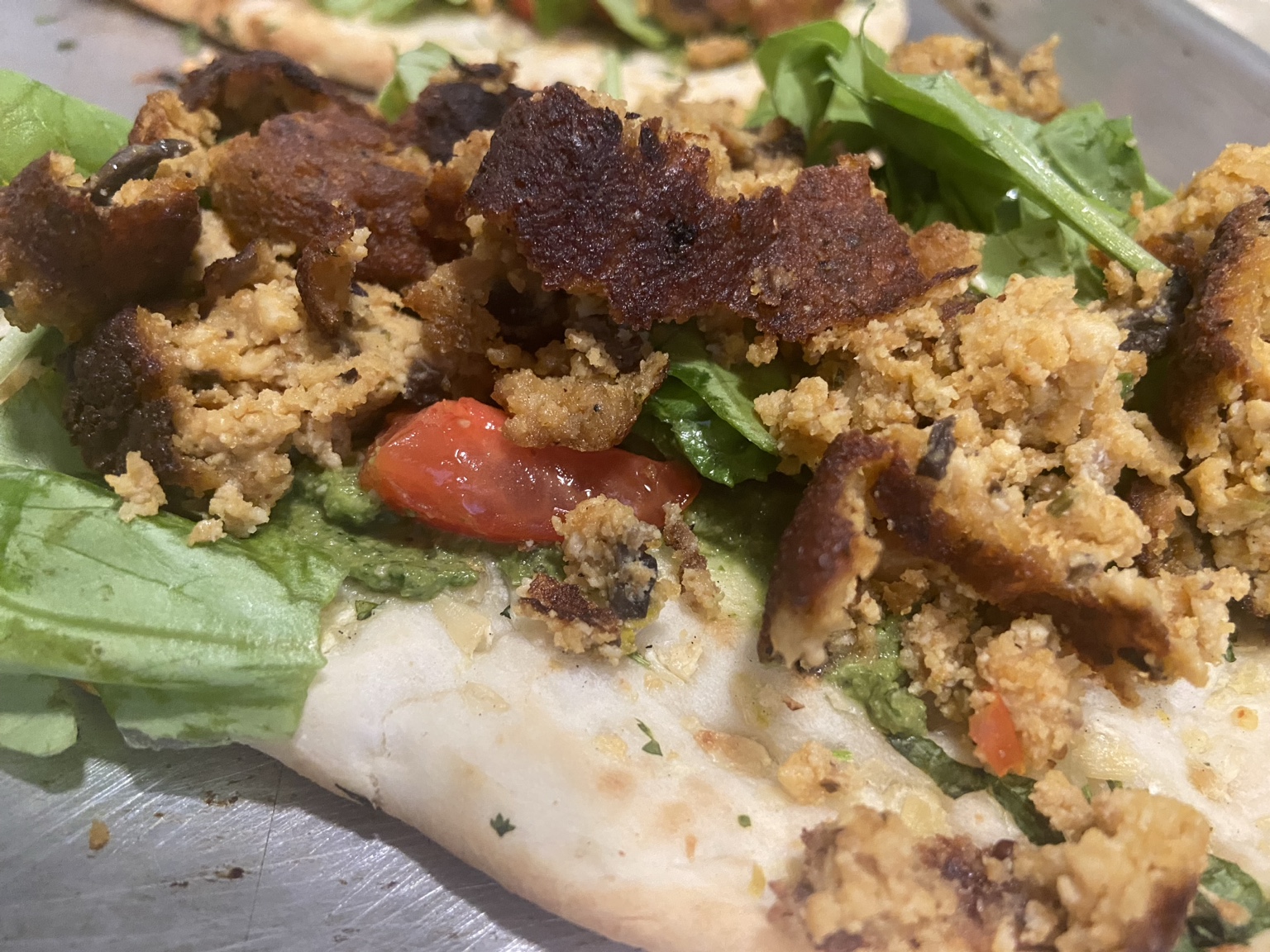 ShapeShifter crumbles on flatbread with greens