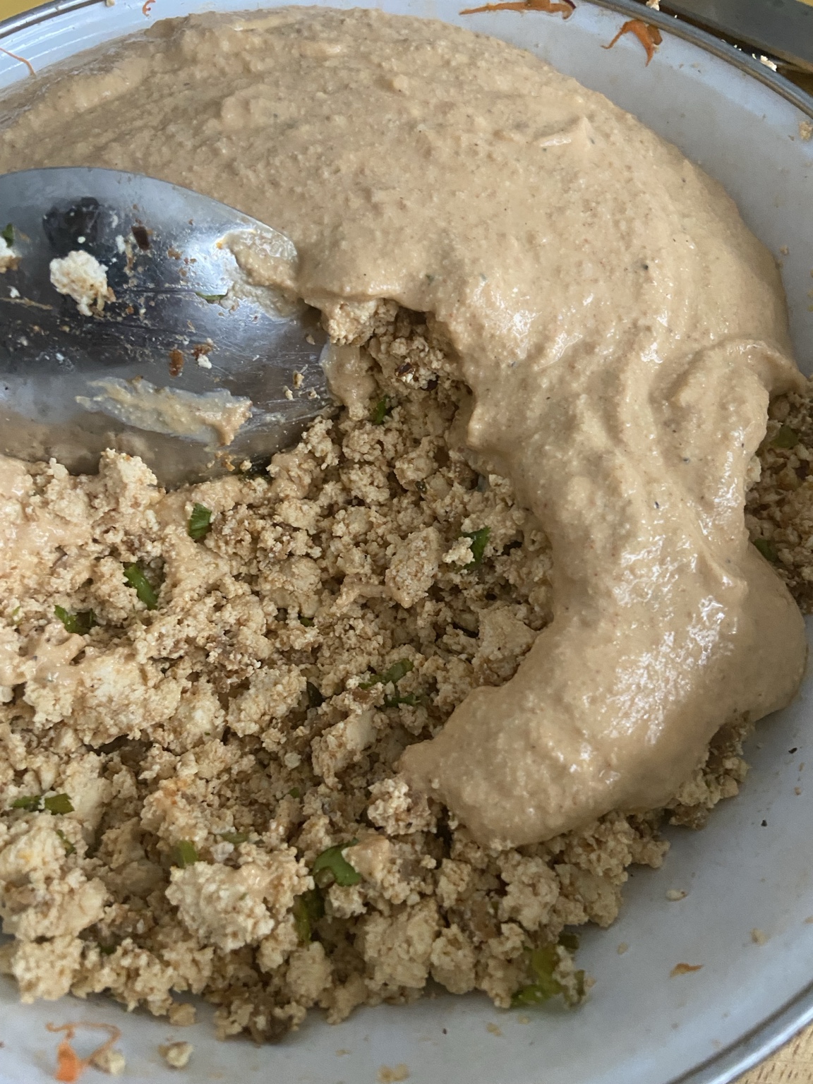 Smooth seasoned tofu meeting the crumbled tofu